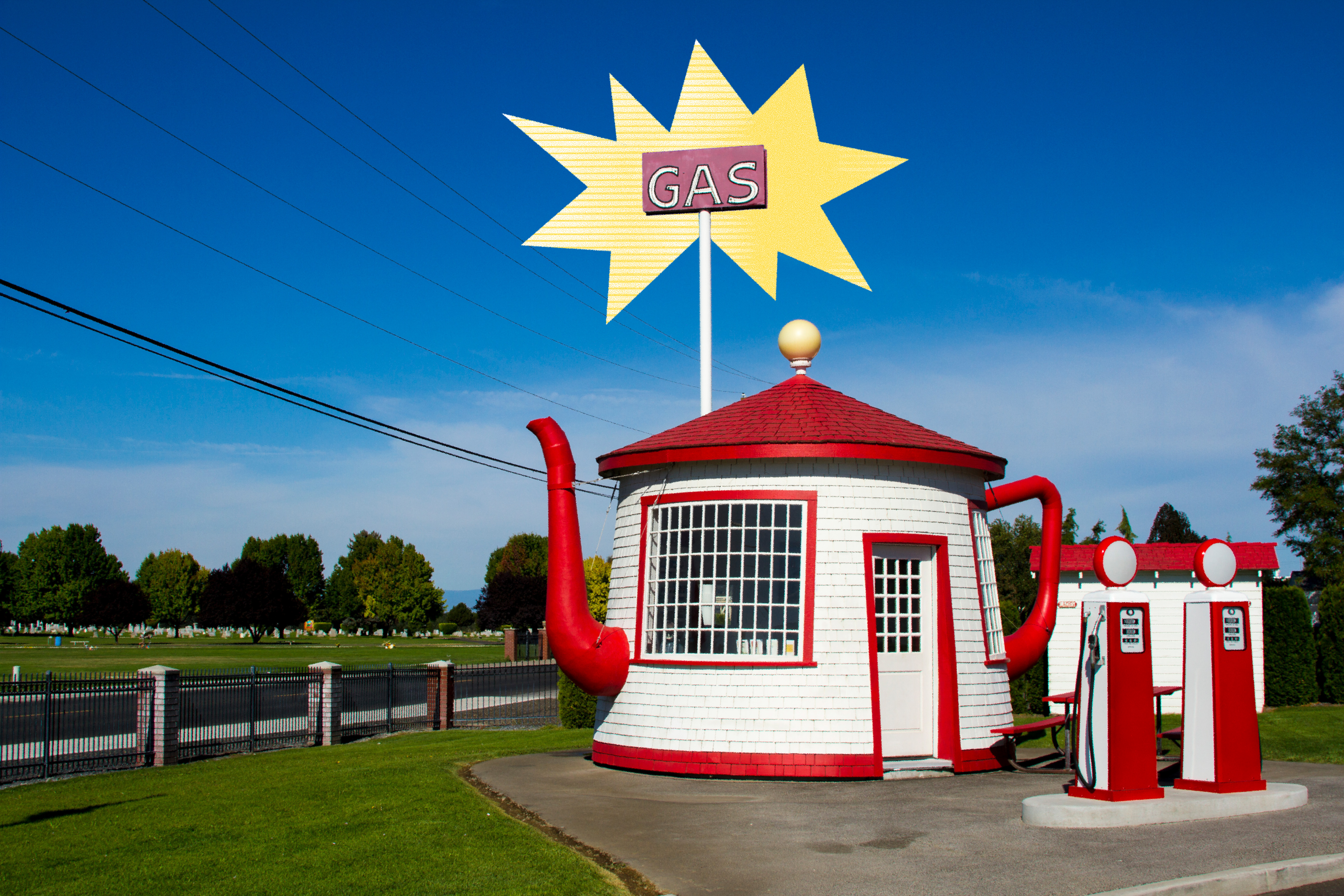 Photo of teapot-shaped gas station infront of large sign that says 'GAS'.